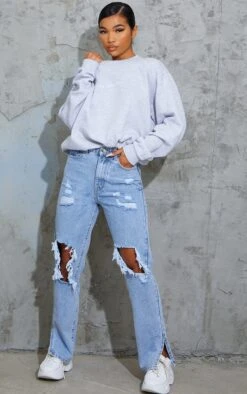 Jean Délavé Bleu Clair Déchiré Sur Les Genoux à Ourlets Fendus